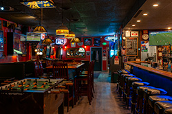 Thumbnail of View of Fred's from between bar and foosball table